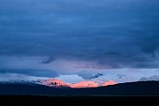 Mountain peaks of the Alaska range with alpenglow